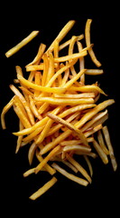 top view of french fries against a black background