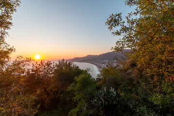 Panoramic view from Alanya Castle on city Buildings during sunset