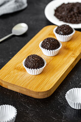 Brigadeiro - traditional Brazilian sweet made from condensed milk, cocoa powder, butter and...