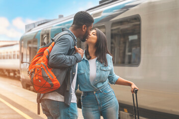 couple kissing on railway station platform. Meeting, saying goodbye spouse, friends. Travel...