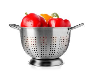 Colander with fresh bell peppers isolated on white