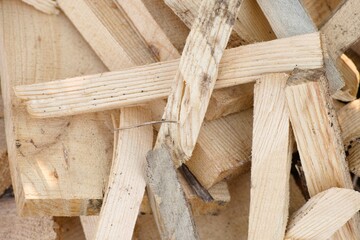 A pile of wooden planks and other pieces of wood