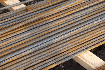 A pile of rusty rebar on a construction site