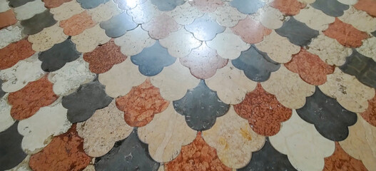 a close up of a tiled floor with a geometric pattern