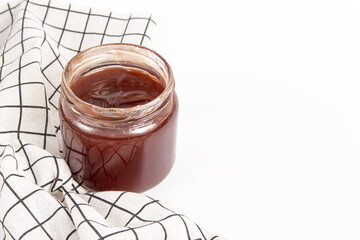 Jam in a glass jar. Free space for text