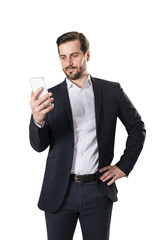 A man in a suit looking at a smartphone, against a white background, conveying a professional concept