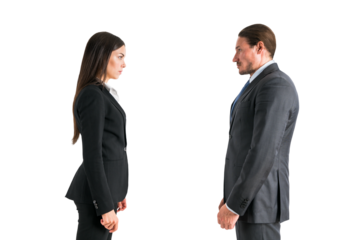 Two professionals in suits standing face to face on a white background, depicting a concept of confrontation or negotiation