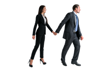 Two professionals in business attire walking hand in hand, isolated on a white background, depicting partnership