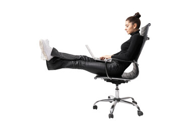 A woman sitting in a black office chair, legs up while using a laptop, on a white background, depicts a relaxed work concept