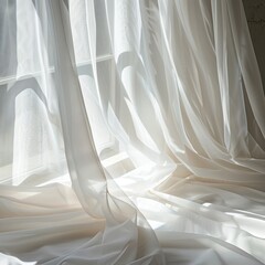 Elegant white sheer curtains with a beautiful drape.