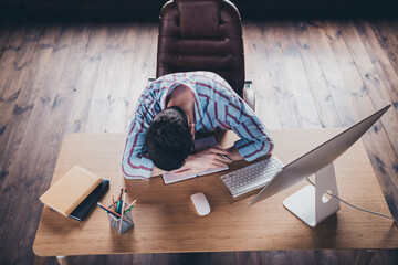 High angle view photo of young corporate man sleep desktop wear striped shirt modern office home...