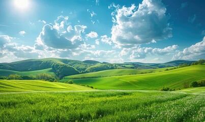 Tranquil beauty of springtime nature in peaceful countryside landscape. Green grass, blue sky, white clouds, rolling hills