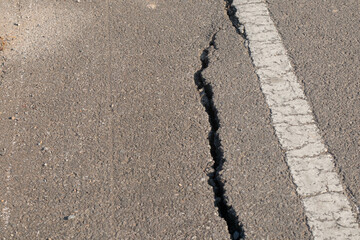 Large cracks in the paved road