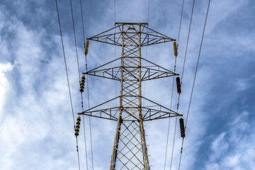 High voltage towers against blue sky background in Brazil