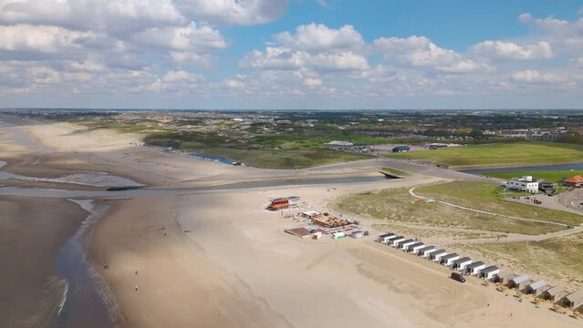 Aerial drone video of the coast and beach in the town named Katwijk, the Netherlands.