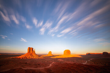Famous view of  Monument Valley in American Southwest at sunset with beautiful clouds