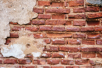Old brick red wall,brickwork from an old brick in rustic style. Structure and pattern of destroyed...