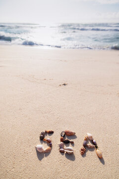 Word sea made of shells on a sandy tropical beach in Seychelles