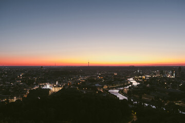 Naklejka premium Scenic aerial view of Vilnius Old Town and Neris river at nightfall. Sunset landscape.