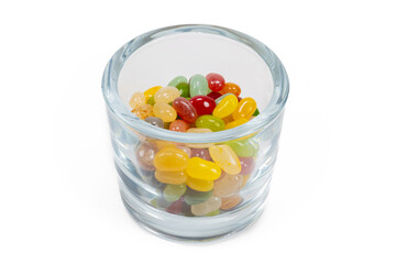 A glass full of candy beans