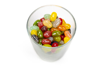 A glass full of candy beans