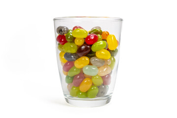 A glass full of candy beans