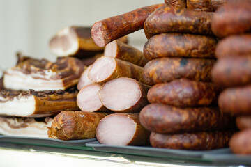 Selection of assorted home made meats, jerky and sausages on a farmers market in Vilnius, Lithuania. Kaziukas, traditional fair in capital of Lithuania.