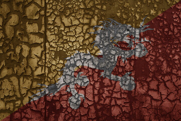 flag of bhutan on a old grunge metal rusty cracked wall background