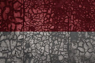 flag of indonesia on a old grunge metal rusty cracked wall background