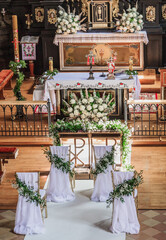 Wedding decorations in a Catholic church. Wedding decorations