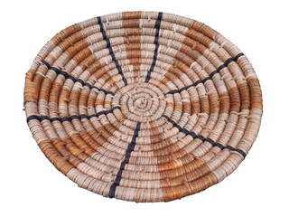 Aerial view of round decorative napkin braided from organic fibers. Handmade indigenous basket....