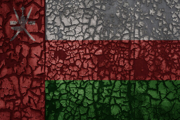 flag of oman on a old grunge metal rusty cracked wall background