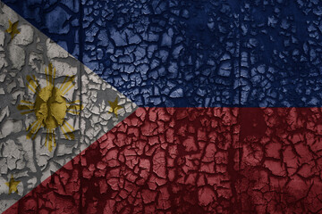 flag of philippines on a old grunge metal rusty cracked wall background