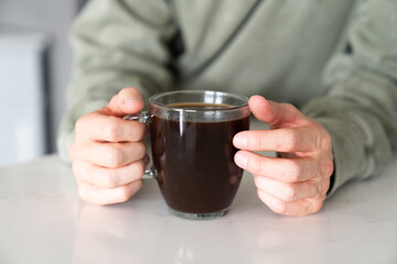 Man Holds His Cup Of Coffee