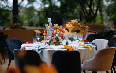 venue for a wedding reception with decor, selective focus on tables and decor. bright decor on the tables