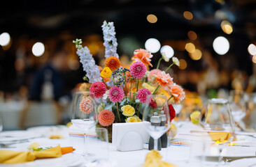 Wedding and festive decor in yellow, orange, red colors. bright decor on the table. wedding feast