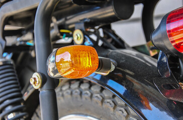detail of a motorcycle. motorcycle turn signal close-up. blurred background