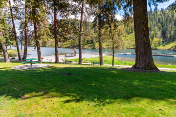 View from the small public Fernan Park and Boat Launch, a lakefront park and fishing spot along Fernan Lake in the downtown district of Coeur d'Alene, Idaho USA.