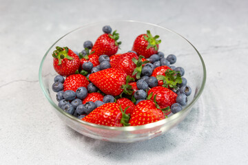 Red ripe strawberry background, close-up, front view, top view, strawberry plate with white background,