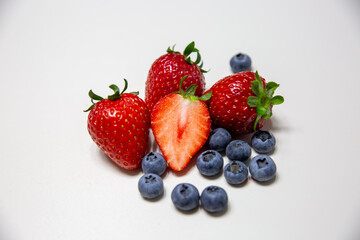 Red ripe strawberry background, close-up, front view, top view, strawberry plate with white background,