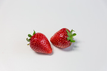 Red ripe strawberry background, close-up, front view, top view, strawberry plate with white background,