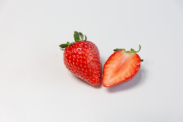 Red ripe strawberry background, close-up, front view, top view, strawberry plate with white background,