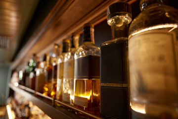 Bar counter with many bottles of alcoholic drinks assortment