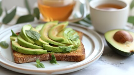 Avocado toast on plate with tea, a delicious food combination