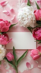 White card adorned with pink and white flowers, set against a pink background