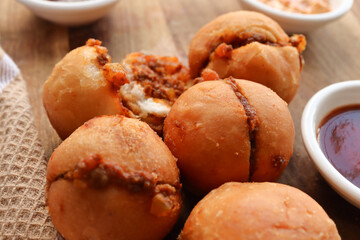 Vetkoek and mince curry. Vetkoek or Amagwinya is a South African food, either eaten as sweet or...
