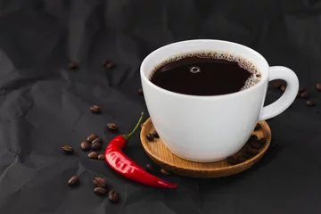 Gardinen Chilischoten Cup of coffee with chili pepper  © Aliaksandra