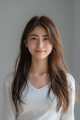 Naklejka premium Japanese Woman With Long Hair in White Shirt