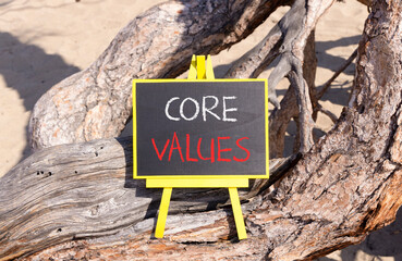 Core values symbol. Concept words Core values on beautiful black yellow blackboard. Beautiful tree...