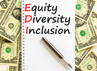 EDI equity diversity inclusion symbol. Concept words EDI equity diversity inclusion on white note. Beautiful dollar bills background. Business EDI equity diversity inclusion concept. Copy space.